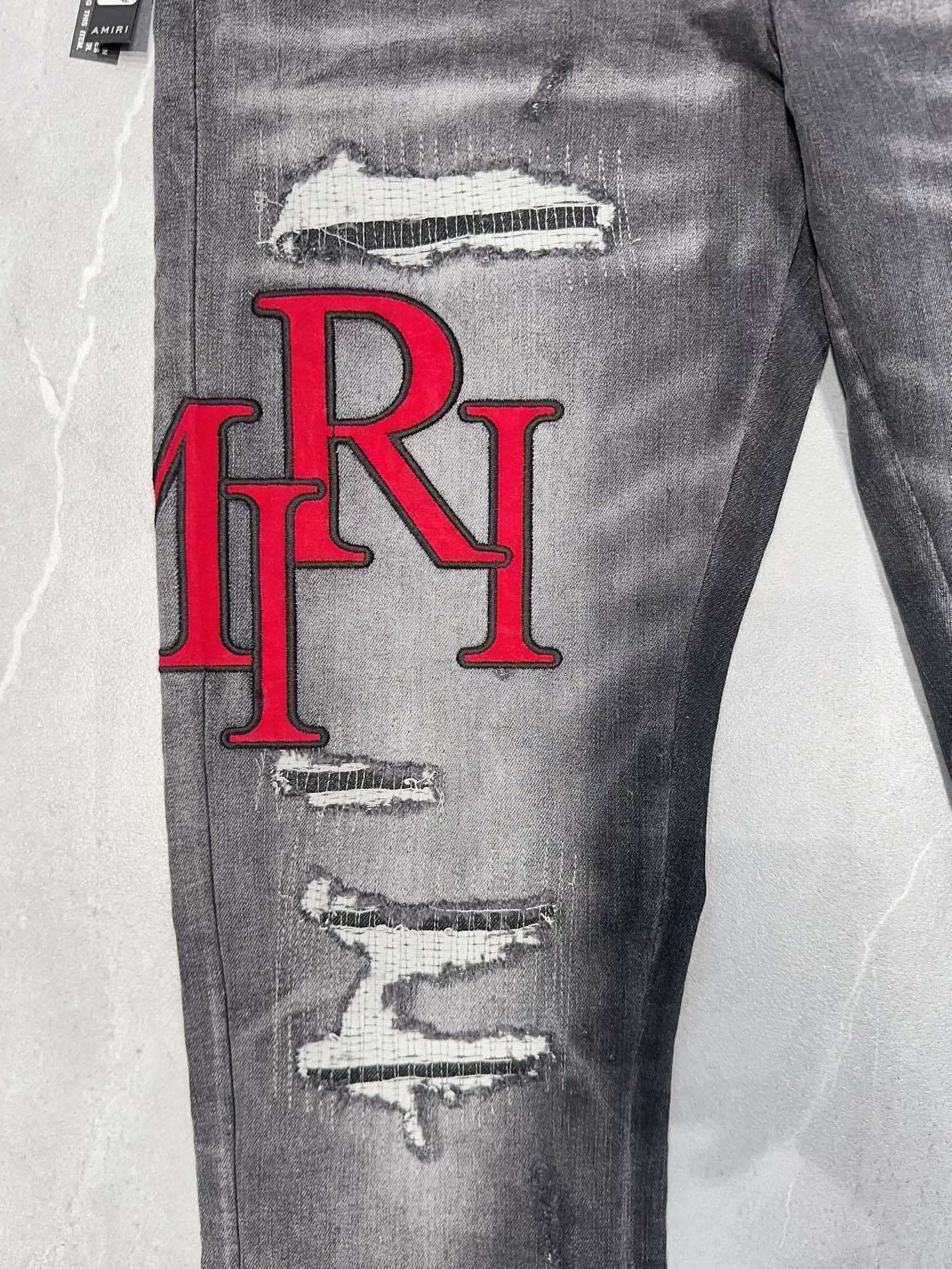 AMIRI DISTRESSED SKINNY JEANS