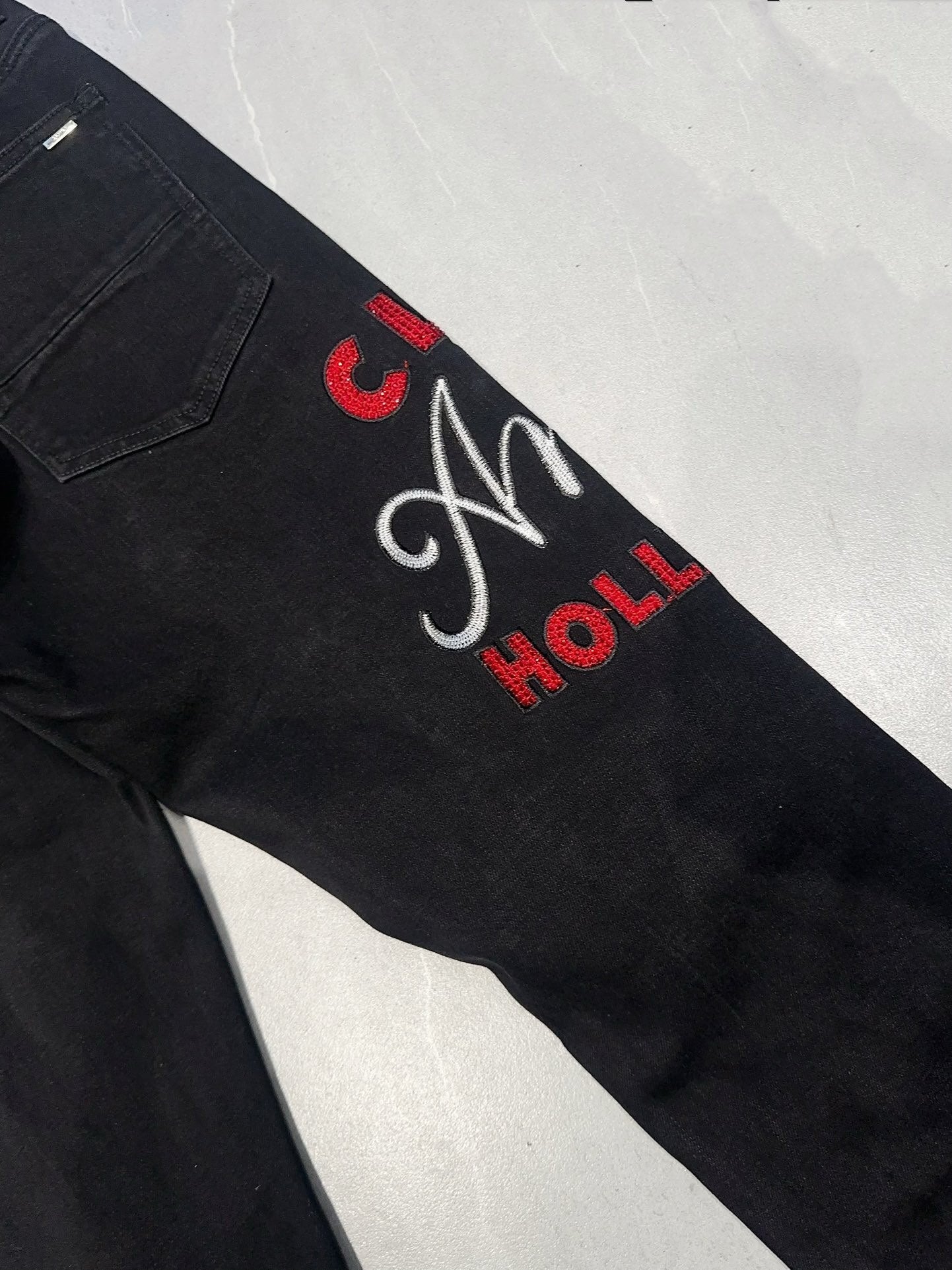 AMIRI EMBROIDERED DISTRESSED JEANS