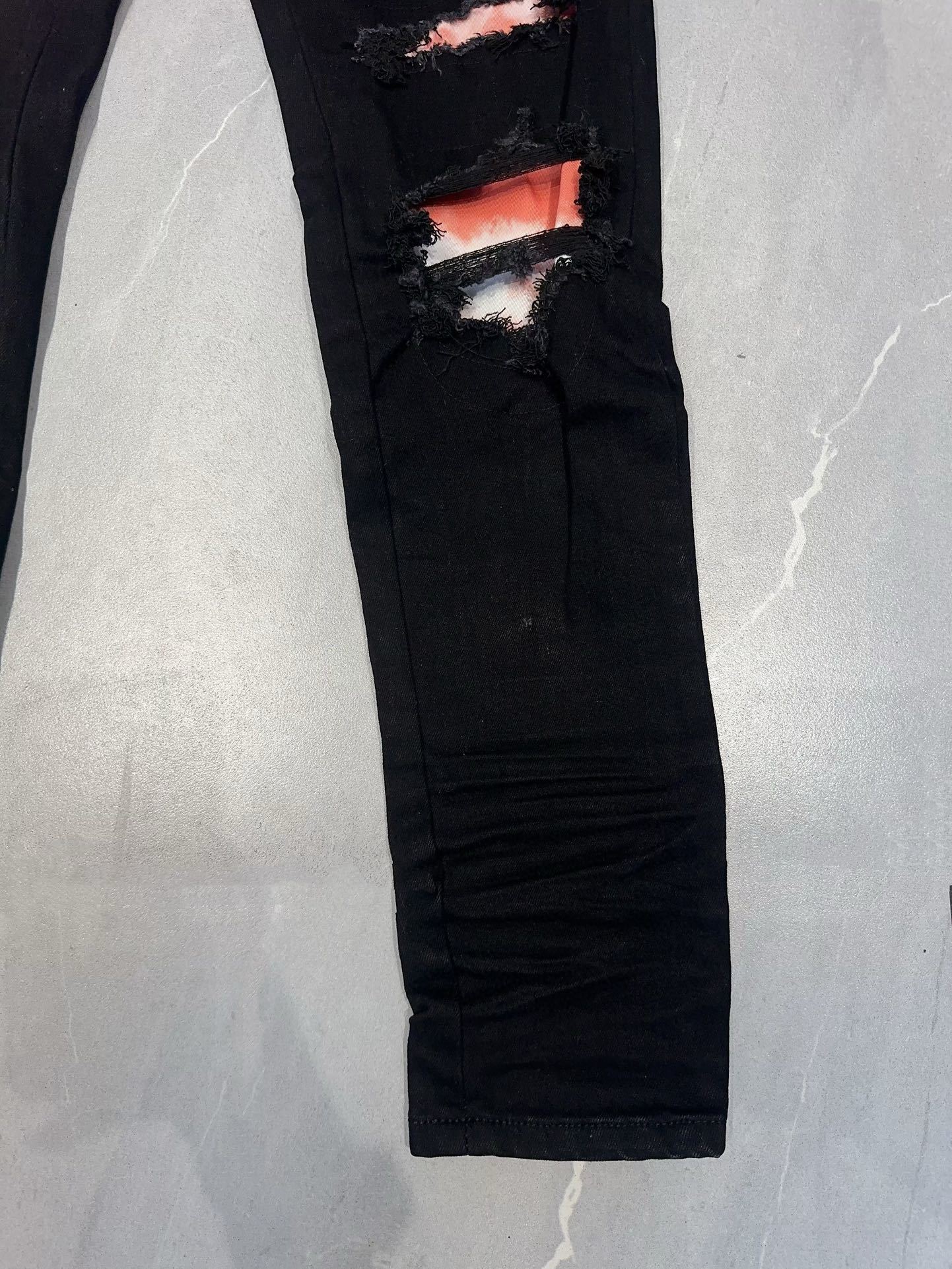 AMIRI WAXED LOGO-APPLIQUE SKINNY JEANS