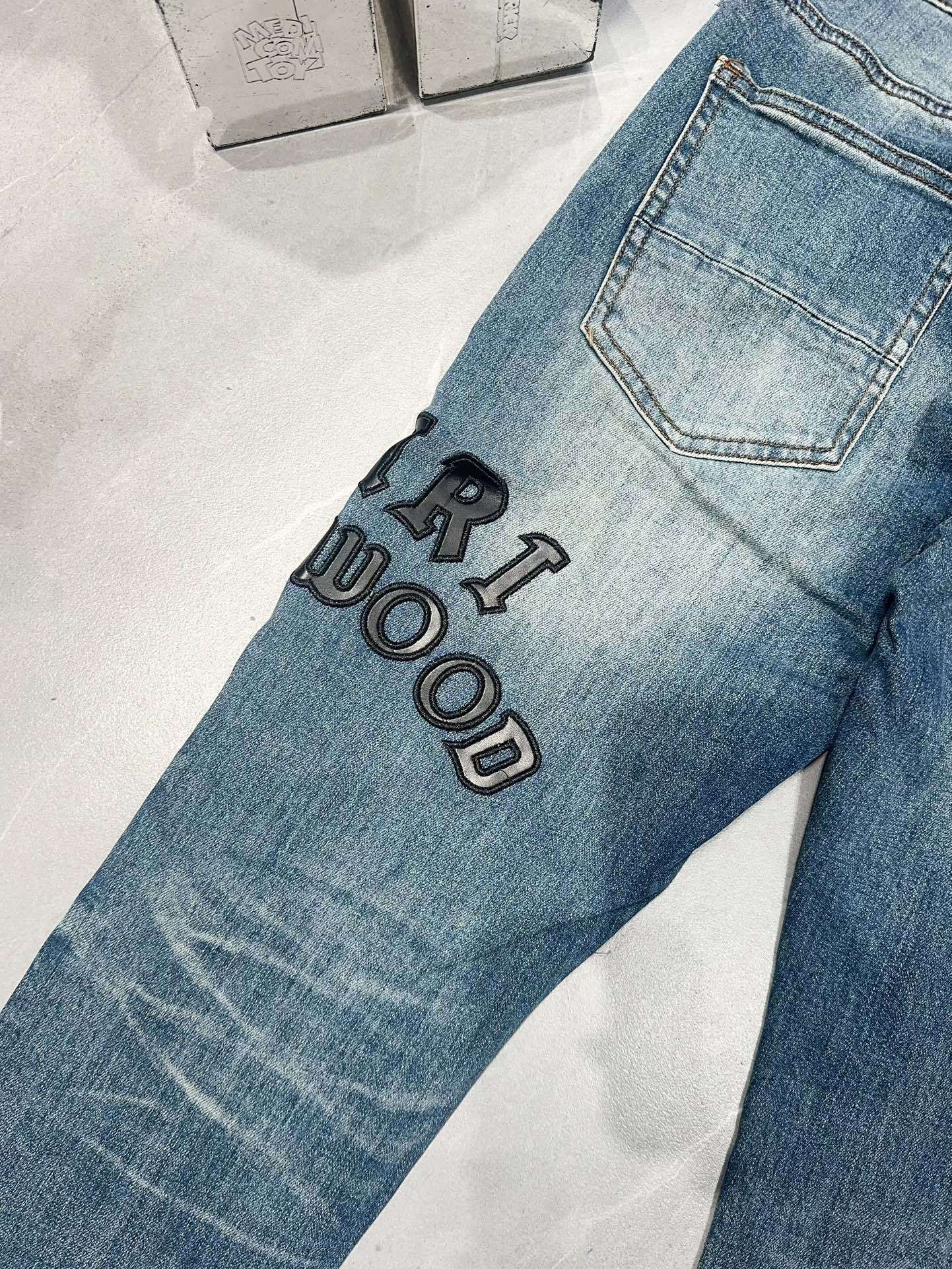 AMIRI DISTRESSED EMBROIDERED JEANS