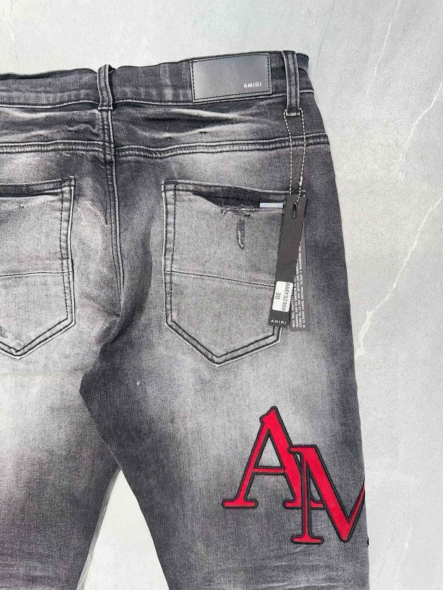 AMIRI DISTRESSED SKINNY JEANS