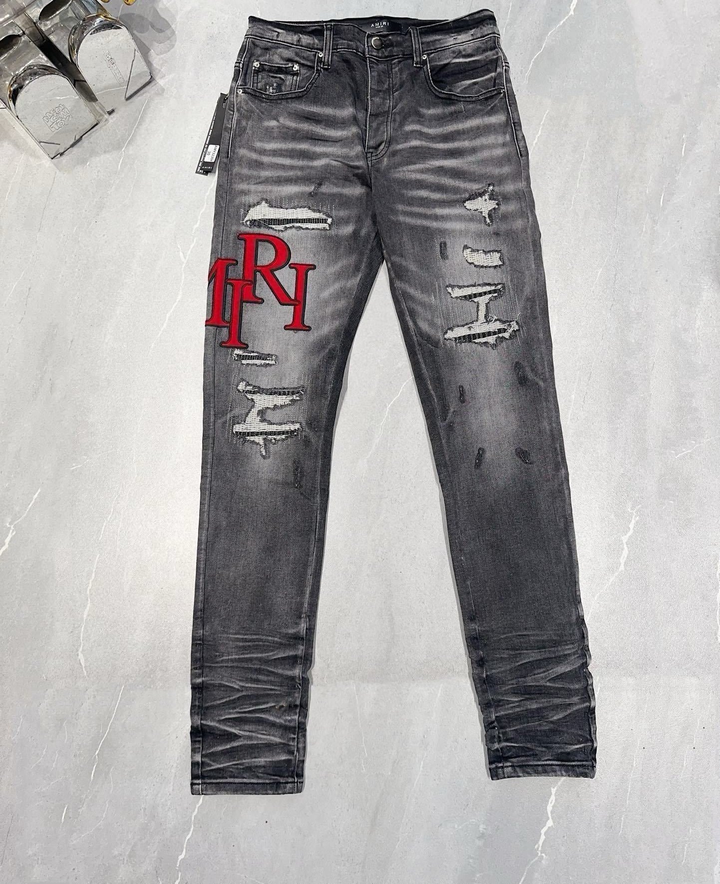 AMIRI DISTRESSED SKINNY JEANS