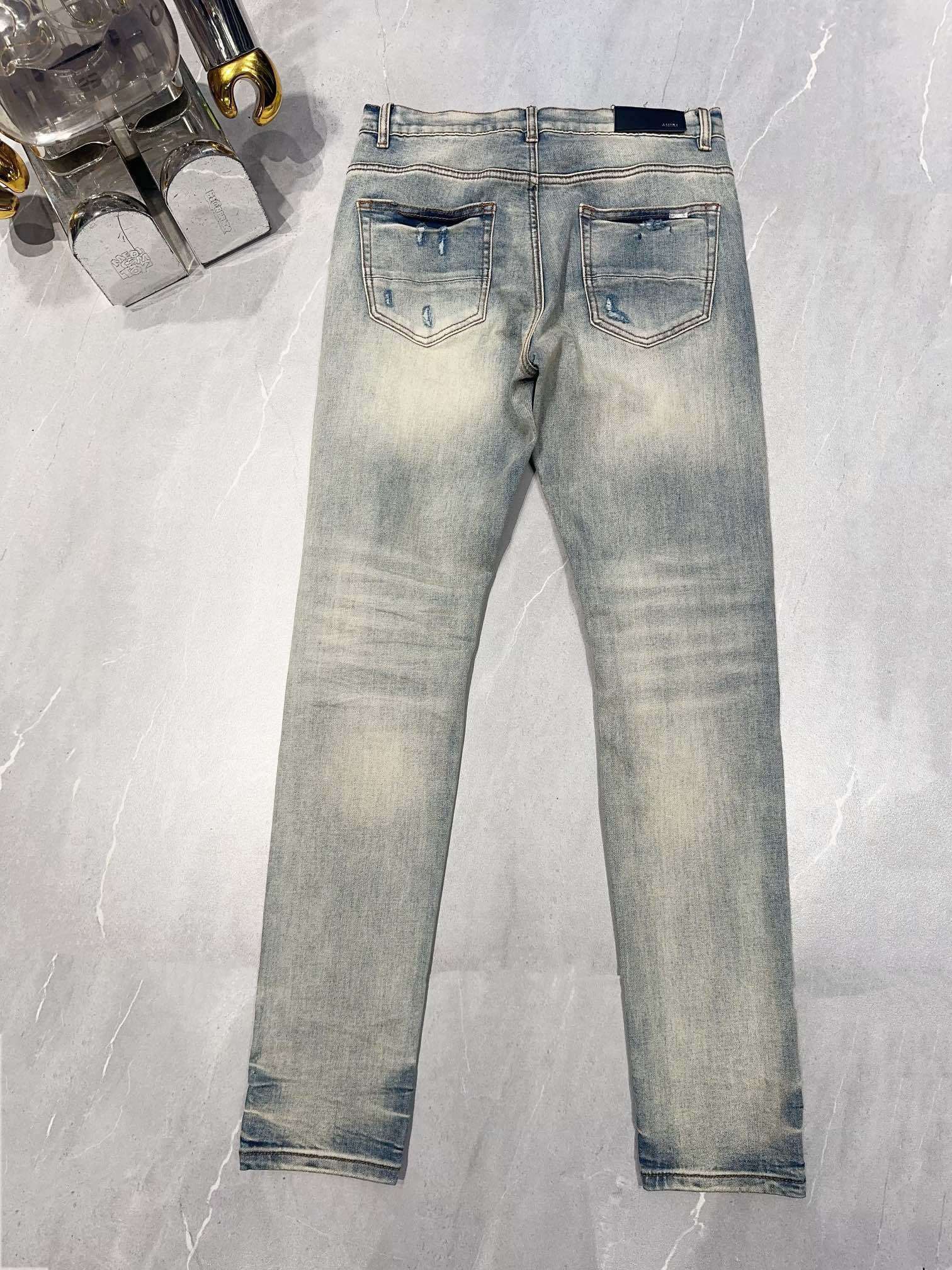 AMIRI MX1 RIPPED SKINNY JEANS