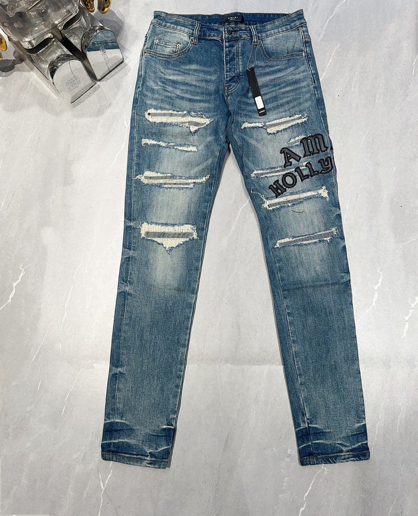 AMIRI DISTRESSED EMBROIDERED JEANS